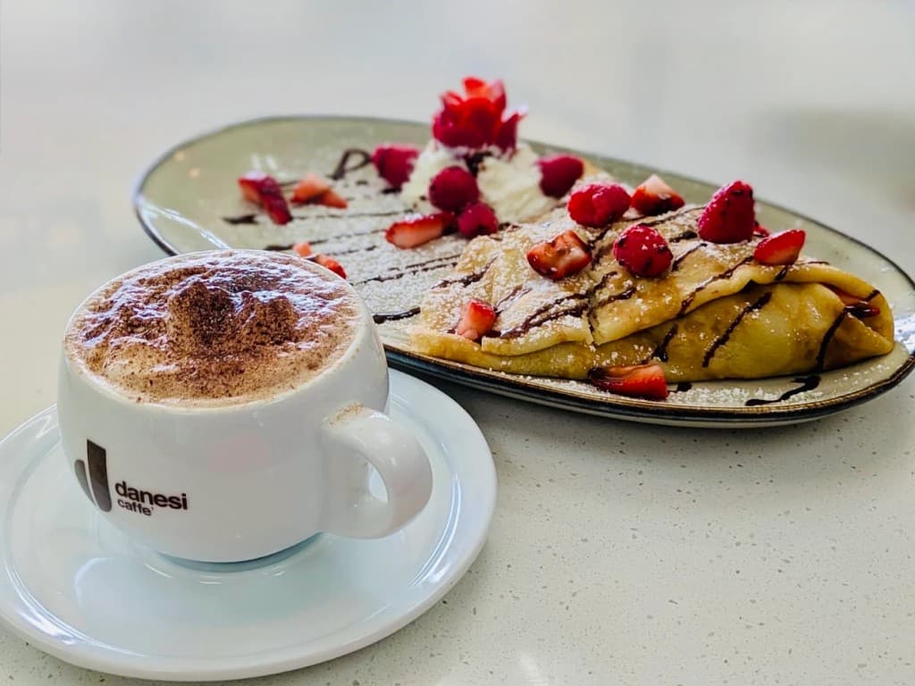 Sweet crepe with berries and coffee